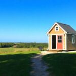 An inviting landscape featuring a tiny house on a picturesque piece of land