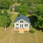 An aerial view of a picturesque tiny house nestled on a rented plot of land